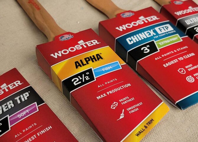 an assortment of packaged Wooster paintbrushes